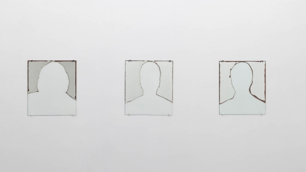 Mancanza di riflessione (original title: Non siamo che immagini negli occhi degli altri), 1994, three partially abraded mirrors, 40 x 40 cm each, ph. Giorgio Benni